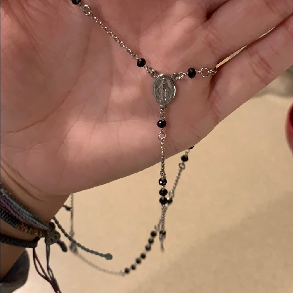 Sterling silver rosary necklace.